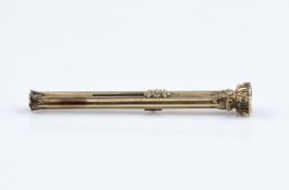 An antique yellow metal combination propelling pencil and dip pen, with ribbed body, engraved