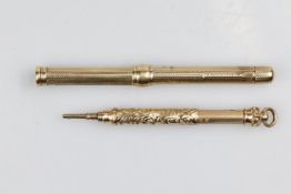 Sampson Mordan & Co, an antique yellow metal propelling pencil, with engine turned barrel, removable
