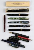 Conway Stewart, a group of fountain pens, including a red bodied 'Dinkie' pen, marbled examples, a