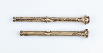 An antique 9ct gold propelling pencil, with engraved barrel and carnelian seal set to foliate