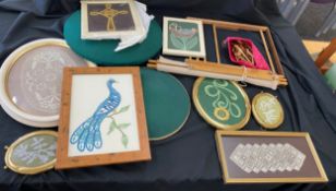 Selection of framed lace patterns, lace bobbin table and cushion