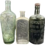 Three antique glass advertising bottles to include Boots, Old Grans Special and Gordons Special