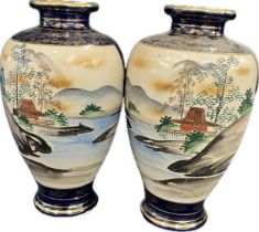 A pair of Japanese satsuma style ceramic vases measuring 12"