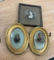 Three antique portrait frames featuring two matching oval gilt frames and a square framed