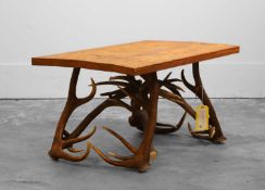 A deer-antler coffee table Of recent manufacture