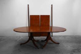 A reproduction George III dining table 20th century