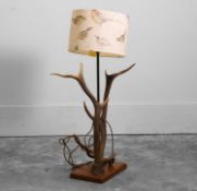 An antler floor lamp with pheasant lampshade,