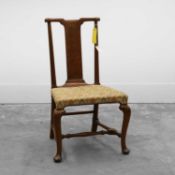 A George II walnut yoke-back chair Mid 18th century