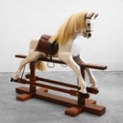 A large painted rocking horse 20th century