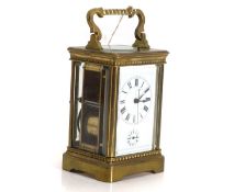 A brass repeating carriage clock 20th century