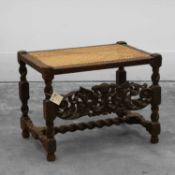 A Caroleon style carved oak stool 19th century