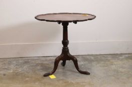 A mahogany tilt-top occasional table In the George III style