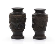 A pair of carved hardwood vases