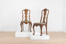 A matched set of fourteen Queen Anne-style walnut dining chairs 20th century