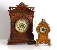 A carved walnut mantel clock Early 20th century, probably German or continental