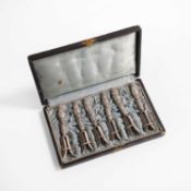 A set of six white metal quail leg holders 20th century