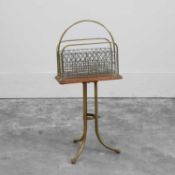 An Edwardian brass and oak magazine rack 20th century