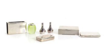 A group of silver smoking items