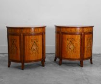 A pair of stainwood and mahogany painted demilune cabinets 20th century