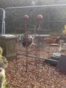 A pair of wrought iron obelisks Of recent manufacture