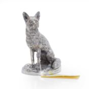 A large silver sitting fox 21st century