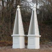 A pair of large modern painted wood obelisk display cases,
