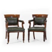 A pair of early Victorian oak carver or desk chairs,