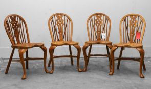 A set of four elm windsor chairs of recent manufacture