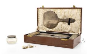 A hallmarked silver dressing table set