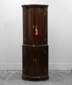A floor-standing George III mahogany corner cabinet 19th century