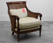 A Regency-style mahogany and cane bergère 20th century