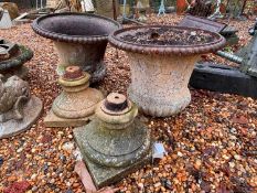 A pair of cast iron urns 20th century