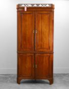 A George III mahogany standing corner cupboard 19th century