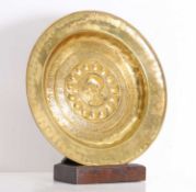 A brass dish/ plaque with classical 'Cicero' medallion 16th century