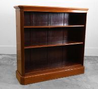 A mahogany open front bookcase 20th century