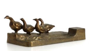 A bronze combination desk stand and inkwell Early 20th century