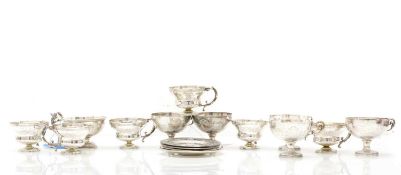 A collection of Egyptian silver cups and saucers
