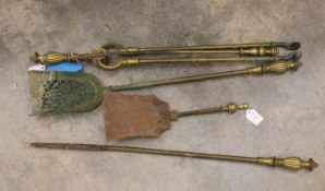 A set of three brass fire implements 19th century