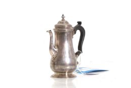 A silver Georgian style coffee pot