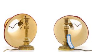 A pair of ormolu candlesticks Late 19th to early 20th century
