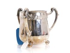 A silver three handled mug