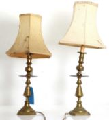 A pair of Victorian brass candlesticks 20th century