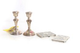 A pair of silver notepad cases