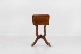 A Regency rosewood and cut-brass teapoy Circa 1820