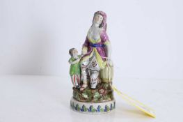 A pearlware figure group of the Widow of Zarephath Early 19th century, Staffordshire