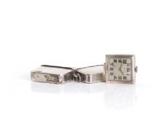 A small silver cased travel clock Circa 1930