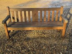 A wooden garden bench Of modern manufacture