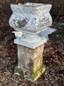 A composite garden urn and stand Of modern manufacture