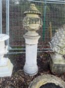 A reconstituted garden urn and cover Of modern manufacture
