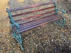 A cast iron and painted garden bench In the Coalbrookdale style,